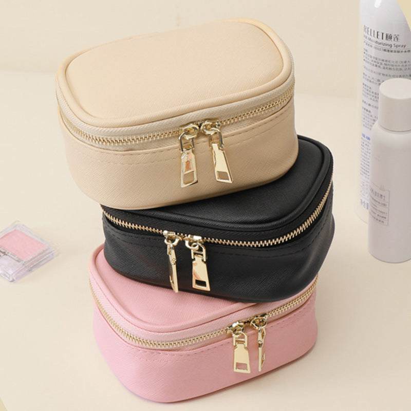 Compact LED makeup bag with built-in light, mirror, USB rechargeable, waterproof PU material, and organized compartments.